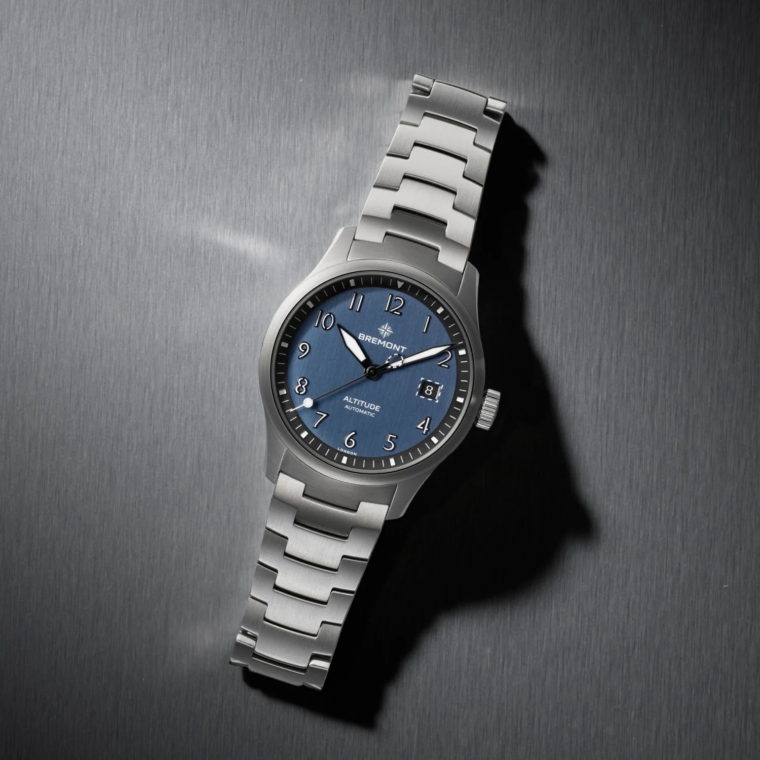 Bremont Silver watch with blue dial on a metallic surface